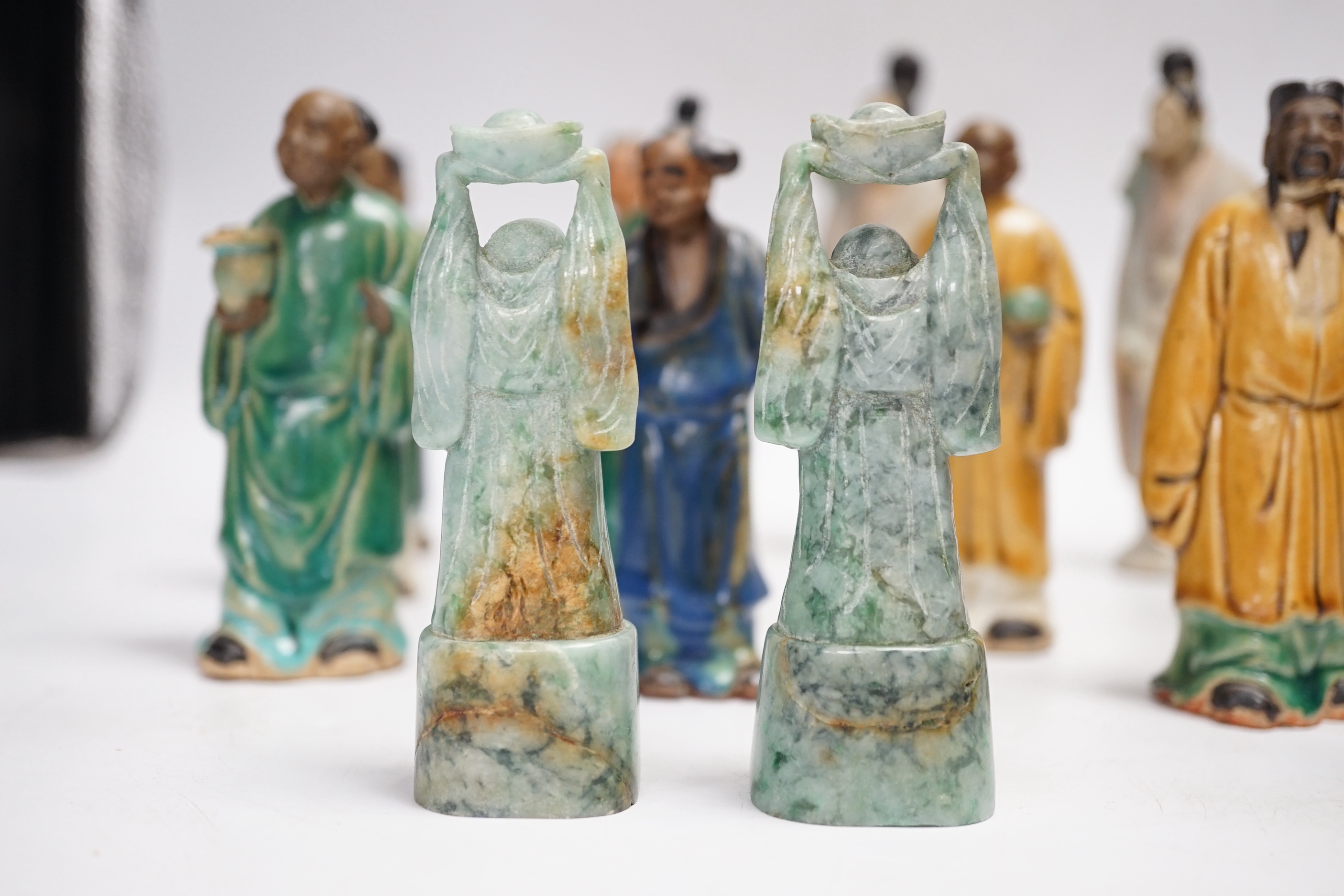 Fifteen Chinese Shiwan-type glazed pottery figures and carved stone figures, early 20th century, tallest 15cm